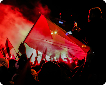Crowd waving flag at event